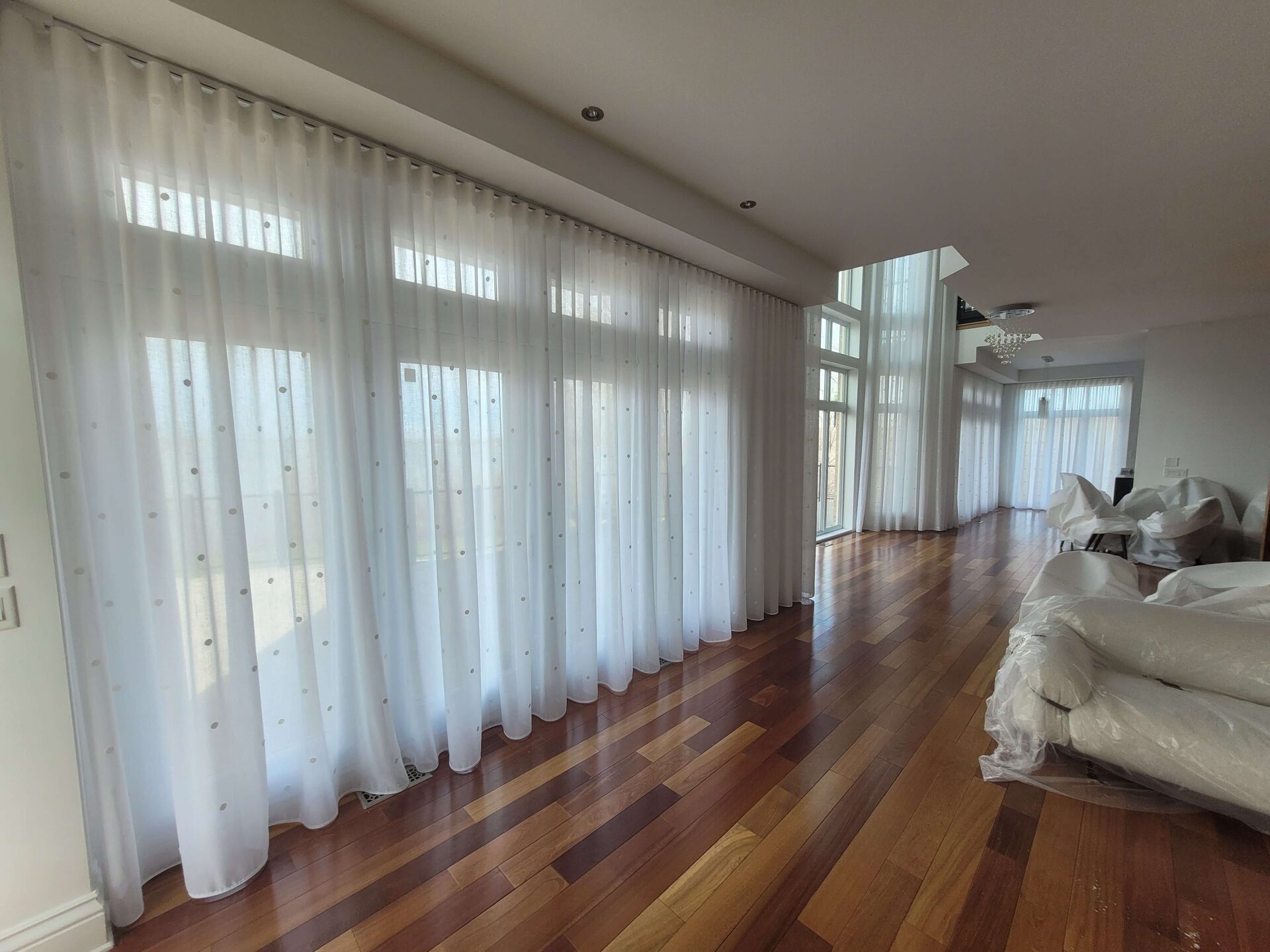 Custom sheers and draperies installed in a South Florida living room